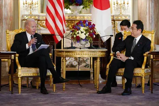 U.S. President Joe Biden, left, talks to Japanese Prime Minister Fumio Kishida during a bilateral meeting at Akasaka Palace, Monday, May 23, 2022, in Tokyo. (AP Photo/Evan Vucci)