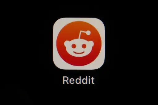The Reddit app icon is seen on a smartphone, Feb. 28, 2023, in Marple Township, Pa. Reddit is due to begin trading on the New York Stock Exchange on Tuesday, March 21, 2024. (AP Photo/Matt Slocum, File)