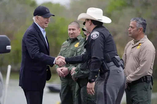 President Joe Biden talks with the U.S. Border Patrol and local officials as he looks over the southern border, Feb. 29, 2024, in Brownsville, Texas, along the Rio Grande. Democrats are trying to outflank Republicans and convince voters they can address problems at the U.S. border with Mexico as immigration likely becomes a major issue in elections that will decide control of Congress. (AP Photo/Evan Vucci, File)