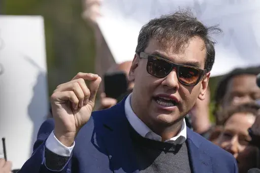 U.S. Rep. George Santos speaks to reporters as he leaves the federal courthouse in Central Islip, N.Y., Wednesday, May 10, 2023. A 13-count federal indictment unsealed in New York accuses Santos of embezzling money from his campaign, falsely receiving unemployment funds and lying to Congress about his finances. (AP Photo/Seth Wenig)