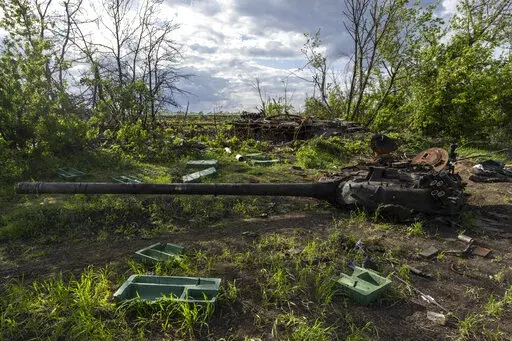 A destroyed tank near the village of Malaya Rohan, Kharkiv region, Ukraine, Monday, May 16, 2022. Twitter is stepping up its fight against misinformation with a new policy cracking down on posts that spread potentially dangerous false stories. Under the new rules, which take effect Thursday, May 19, 2022, Twitter will no longer automatically recommend posts that mischaracterize conditions during a conflict or make misleading claims about war crimes or atrocities. (AP Photo/Bernat Armangue, File)