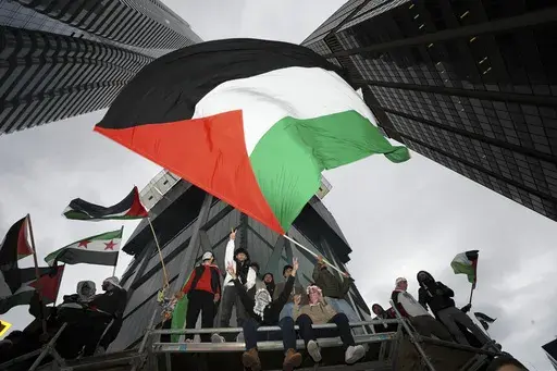 Supporters wave the Palestine flag at a march in Toronto, on Oct. 9, 2023. Before it transformed into X, Twitter was the place to turn to for live and reliable information about big news events, from wars to natural disasters. But as the Israel-Hamas war has underscored, that is no longer the case. (Arlyn McAdorey/The Canadian Press via AP, File)