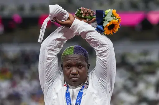Raven Saunders, of the United States, poses with her silver medal in women's shot put at the 2020 Summer Olympics, Sunday, Aug. 1, 2021, in Tokyo, Japan. Saunders, the silver-medal shot putter who used her platform at the Tokyo Olympics to bring attention to social injustice, has been suspended for 18 months for failing to show up for doping tests. The U.S. Anti-Doping Agency announced the sanction Wednesday, March 15, 2023, for the 26-year-old, saying she had committed three “whereabouts fail