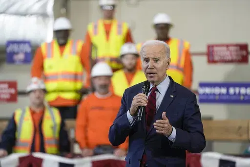 President Joe Biden delivers remarks on his economic agenda at a training center run by Laborers' International Union of North America, Feb. 8, 2023, in Deforest, Wis. The Biden administration on Friday, Sept. 29, is releasing a playbook on best practices for training workers — as the low 3.8% unemployment rate and years of underinvestment have left manufacturers, construction firms and other employers with unfilled jobs. (AP Photo/Morry Gash, File)
