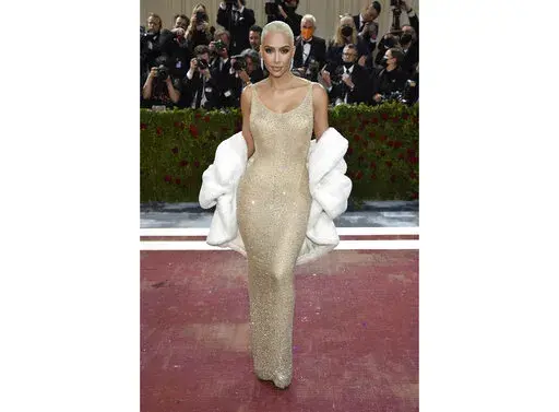 Kim Kardashian wears the iconic dress worn by Marilyn Monroe at The Metropolitan Museum of Art's Costume Institute benefit gala in New York on May 2, 2022.  Some Monroe enthusiasts believe the dress was damaged after Kardashian wore it but the Ripley’s Believe It or Not! attraction in Hollywood, Calif., where the garment is on display, denies that claim. (Photo by Evan Agostini/Invision/AP, File)