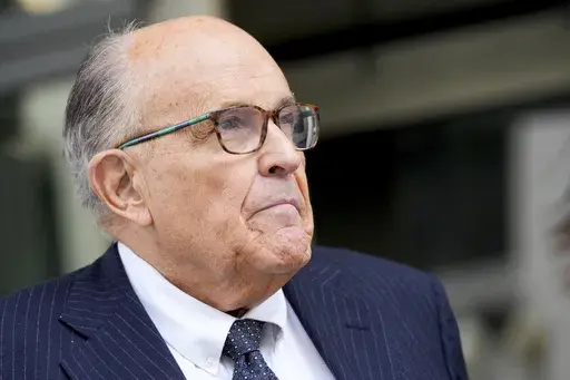 Rudy Giuliani speaks with reporters as he departs the federal courthouse, May 19, 2023, in Washington. Giuliani, the former mayor of New York City, says a woman’s lawsuit alleging he coerced her into sex and owes her nearly $2 million in unpaid wages is “a large stretch of the imagination” filled with exaggerations and salacious details “to create a media frenzy.” (AP Photo/Patrick Semansky, File)