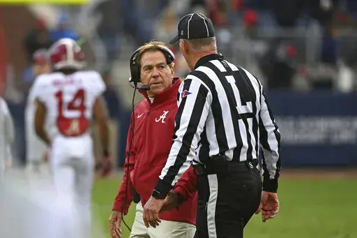 Alabama head coach Nick Saban talks with an official during the first half of an NCAA college football game against Mississippi in Oxford, Miss., Saturday, Nov. 12, 2022. (AP Photo/Thomas Graning)