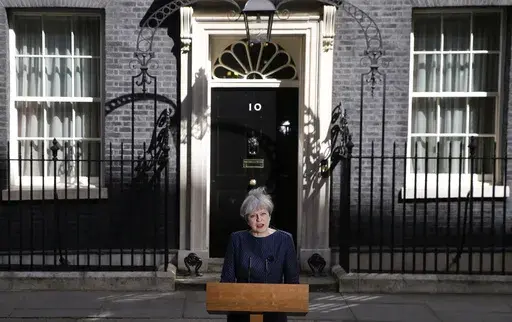 Britain's Prime Minister Theresa May speaks to the media outside her official residence of 10 Downing Street in London, Tuesday April 18, 2017. Theresa May, who succeeded David Cameron after he resigned following Britain's vote to leave the European Union in a referendum in June 2016, sought to capitalize on the Conservative Party's big opinion poll lead and called an early general election for June 2017. (AP Photo/Alastair Grant, File)