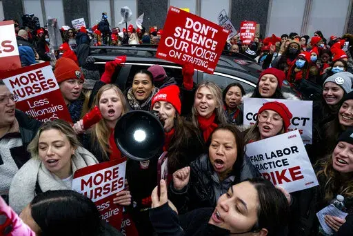 Nurses stage a strike in front of Mt. Sinai Hospital in the Manhattan borough of New York Monday, Jan. 9, 2023, after negotiations broke down hours earlier. (AP Photo/Craig Ruttle)