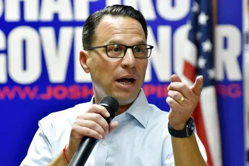 Josh Shapiro, Pennsylvania's Democratic nominee for governor, speaks to the crowd during a campaign event at Adams County Democratic Party headquarters, Sept. 17, 2022, in Gettysburg, Pa. (AP Photo/Marc Levy)
