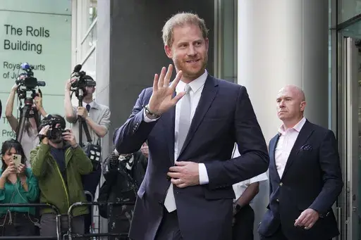 Prince Harry leaves the High Court after giving evidence in London, Wednesday, June 7, 2023. Prince Harry is seeking 320,000 pounds ($406,000) in his phone hacking lawsuit against Mirror Group Newspapers. The Duke of Sussex's lawyer submitted the claim in a court document Friday, June 30, 2023, at the conclusion of the trial that began in early May. (AP Photo/Kin Cheung, File)