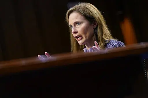 Supreme Court nominee Amy Coney Barrett speaks during a confirmation hearing before the Senate Judiciary Committee, Oct. 14, 2020, on Capitol Hill in Washington. In one form or another, every Supreme Court nominee is asked during Senate hearings about his or her views of the landmark abortion rights ruling that has stood for a half century. Now, a draft opinion obtained by Politico suggests that a majority of the court is prepared to strike down the Roe v. Wade decision from 1973, leaving it to 