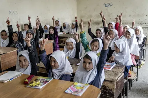 Afghan school girls attend their classroom on the first day of the new school year, in Kabul, Saturday, March 25, 2023. (AP Photo/Ebrahim Noroozi, File)