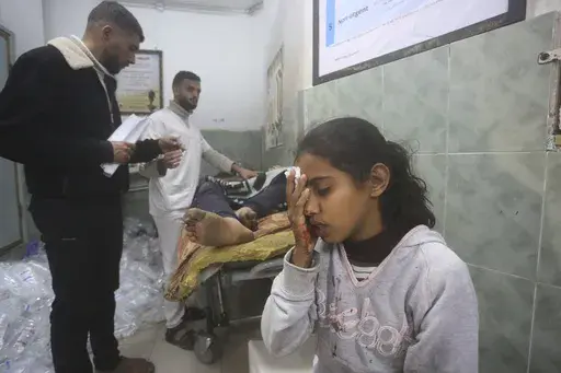 Palestinians wounded in Israeli bombardment receive treatment in a hospital t in Rafah, Gaza Strip, Monday, Feb. 5, 2024. (AP Photo/Hatem Ali)