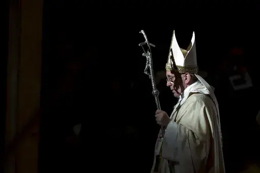 Pope Francis holds the pastoral staff as he leaves after celebrating a Mass in St. Peter's Basilica, at the Vatican, to mark Epiphany, Jan. 6, 2014. Pope Francis celebrates the 10th anniversary of his election Monday, March 13, 2023, far outpacing the "two or three" years he once envisioned for his papacy and showing no signs of slowing down. (AP Photo/Andrew Medichini, File)