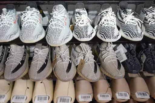 Yeezy shoes made by Adidas are displayed at Laced Up, a sneaker resale store, in Paramus, N.J., on Oct. 25, 2022. Adidas forecast it may have to write off the remaining 300 million euros ($320 million) worth of Yeezy shoes left unsold after it cut ties with rapper Ye, formerly known as Kanye West. The company on Wednesday, Nov. 8, 2023 said it will decide in the coming weeks whether or not to do a third release of the shoes next year to generate more donations to groups fighting anti semitism. (