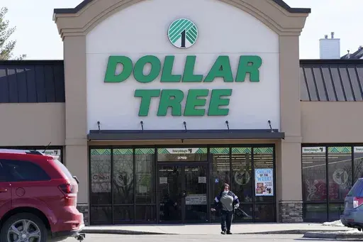 A woman leaves a Dollar Tree store in Urbandale, Iowa, on Feb. 25, 2021. (AP Photo/Charlie Neibergall, file)