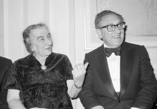 Former U.S. Secretary of State Henry Kissinger and former Israeli Prime Minister Golda Meir chat after an American Jewish Congress Dinner, Sunday night Nov. 4, 1977, in New York. Henry Kissinger's legacy in the Mideast is the pursuit of what's possible, not necessarily peace, in one of the world's most intractable conflicts. The former U.S. secretary of state, who died this week at age 100, did just that after Egypt and Syria pulled of a surprise invasion of Israel 50 years ago. (AP Photo/Ira Sc