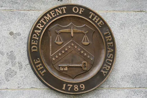 The Department of the Treasury's seal outside the Treasury Department building in Washington on May 4, 2021. The United States has slapped more sanctions on people and firms associated with Iran and with what it calls an illicit banking network used to conceal transactions. The U.S. said Thursday it placed the penalties on 39 firms linked to a shadow banking system that helped to muddy financial activity between sanctioned Iranian firms and foreign buyers, namely for petrochemicals. (AP Photo/Pa