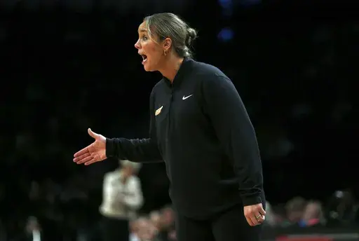 Tennessee head coach Kim Caldwell yells from the bench during the second half of an NCAA college basketball game against Iowa, Dec. 7, 2024, in New York. (AP Photo/John Munson, File)