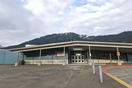 The Glacier Valley Elementary School is seen in Juneau, Alaska, on Tuesday, June 14, 2022. A dozen students and two adults were served floor sealant instead of milk at the school after containers were apparently mixed up, the superintendent said Wednesday. Several children complained of burning sensations in their mouth and throats, and at least one child was treated at the local hospital after the Tuesday morning mix-up, Superintendent Bridget Weiss said. (Ben Hohenstatt/The Juneau Empire via A