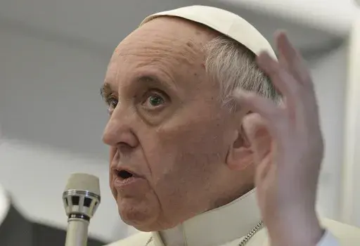 In this July 29, 2013 file photo, Pope Francis answers reporters questions during a news conference aboard the papal flight of his famous quip "Who am I to judge?", on the journey back from Brazil. Francis' apology Tuesday, May 28, 2024, for using a vulgar term to refer to gay men was the latest comment to make headlines about the Catholic Church's teachings on homosexuality. Francis has made a hallmark of reaching out to LGBTQ+ Catholics, but his 11-year pontificate has also seen plenty of prob