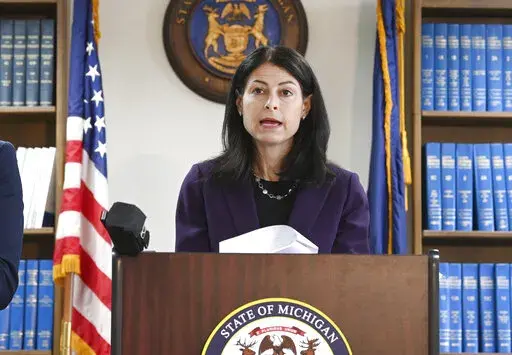 Attorney General Dana Nessel announces charges for several security guards from Northland Mall in the 2014 death of McKenzie Cochran during a news conference in Detroit on Thursday, Oct. 14, 2021. Nessel is asking federal prosecutors, Thursday, Jan. 13, 2022, to open a criminal investigation into 16 Republicans who submitted false certificates stating they were the state’s presidential electors despite Joe Biden’s 154,000-vote victory in 2020. (Max Ortiz/Detroit News via AP)