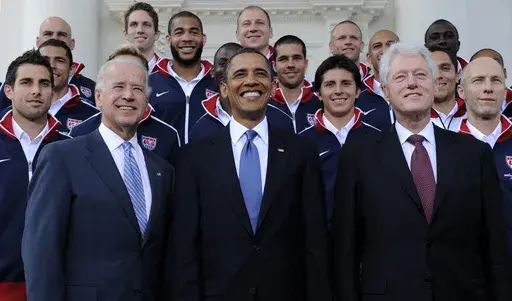 President Barack Obama, flanked by Vice President Joe Biden, left, and former President Bill Clinton, right, pose for a photo with the U.S. World Cup soccer team under the North Portico of the White House in Washington, May 27, 2010. President Joe Biden will share a stage with Barack Obama and Bill Clinton on Thursday in New York as he raises money for his reelection campaign. It's a one-of-a-kind political extravaganza that will showcase decades of Democratic leadership. (AP Photo/Susan Walsh, 