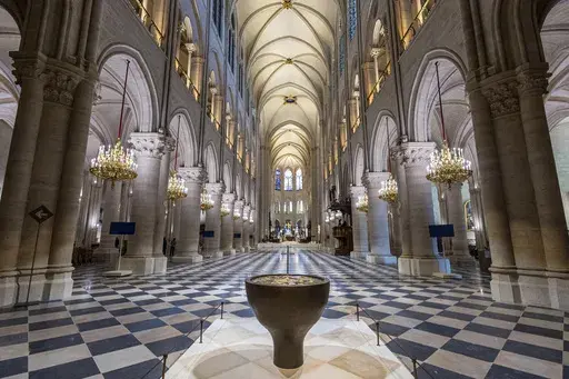 The baptistery designed by French artist and designer Guillaume Bardet is pictured as French President Emmanuel Macron visits the restored interiors of the Notre-Dame de Paris cathedral, Friday, Nov. 29, 2024 in Paris. (Christophe Petit Tesson/Pool via AP, File)