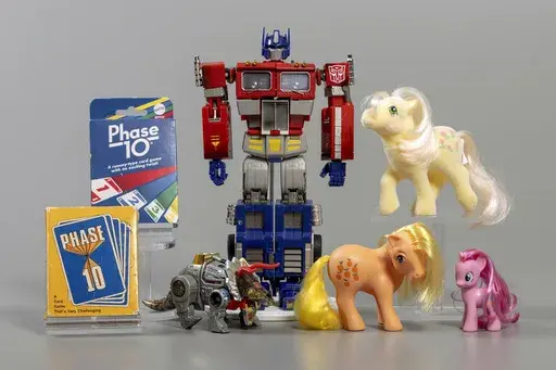 This undated photo provided by the The Strong museum, in Rochester, NY, shows the 2024 National Toy Hall of Fame Inductees: My Little Pony, Phase 10, and Transformers. (The Strong via AP)
