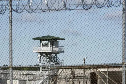 In this April 16, 2018, photo, a guard tower stands above the Lee Correctional Institution, a maximum security prison in Bishopville, S.C. South Carolina has given the greenlight to firing-squad executions. The method was codified into state law last year after a decade-long pause in carrying out the death sentence over the state's inability to procure lethal injection drugs. State prison officials said Friday, March 18, 2022, that renovations have been completed on the death chamber in Columbia