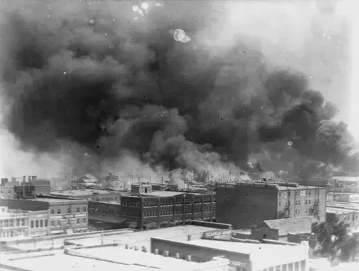 In this 1921 image provided by the Library of Congress, smoke billows over Tulsa, Okla. (Alvin C. Krupnick Co./Library of Congress via AP, File)
