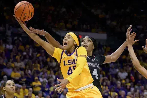 LSU guard Alexis Morris (45) shoots against Mississippi State forward Jessika Carter (4) in the second half of an NCAA college basketball game Sunday, Feb. 26, 2023, in Baton Rouge, La. (AP Photo/Matthew Hinton)