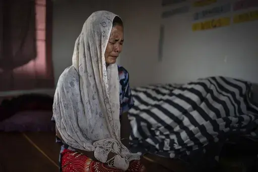 Kim Neineng, 43, a tribal Kuki, cries as she narrates the killing of her husband, at a relief camp in Churachandpur, in the northeastern Indian state of Manipur, Tuesday, June 20, 2023. Neineng escaped with her four children to a nearby relief camp when a Meitei mob descended on their village. Her husband was killed by the mob — beaten with iron bars, his legs chopped off and then picked and tossed in the raging fire that had already engulfed his home. The deadly conflict between the two ethni