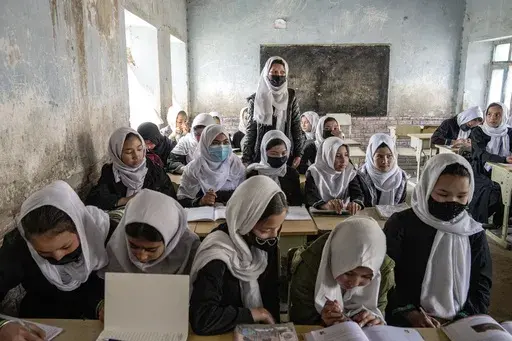 Afghan school girls attend their classroom on the first day of the new school year, in Kabul, Saturday, March 25, 2023. The new Afghan educational year started in Afghanistan, while high school remained closed for girls for the second year after Taliban returned to power in 2021. (AP Photo/Ebrahim Noroozi)