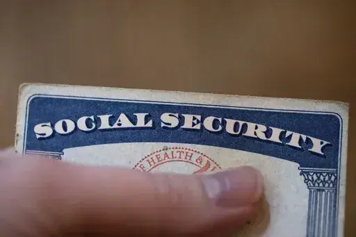 A Social Security card is displayed on Oct. 12, 2021, in Tigard, Ore. About 71 million people including retirees, disabled people and children receive Social Security benefits. (AP Photo/Jenny Kane, File)