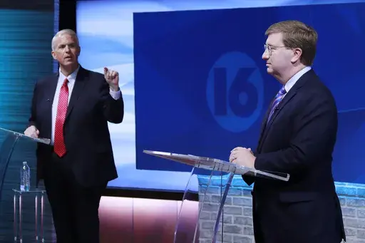 Brandon Presley, the Democratic nominee for governor, left, debates with Republican Mississippi Gov. Tate Reeves during a televised gubernatorial debate Wednesday, Nov. 1, 2023, in Jackson, Miss. (Brett Kenyon/WAPT via the AP)