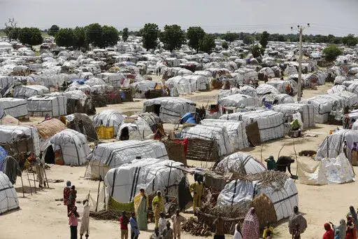 A top view of one of the biggest camp for people displaced by Islamist extremists in Maiduguri, Nigeria on Aug. 28, 2016. Droughts, flooding and a shrinking Lake Chad caused in part by climate change is fueling conflict and migration in the region and needs to better addressed, a report said Thursday, Jan. 19, 2023. ( AP Photo/Sunday Alamba, File)