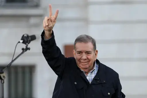 Venezuelan opposition leader Edmundo González waves to supporters at Puerta del Sol in downtown Madrid, Spain, Sept. 28, 2024. (AP Photo/Bernat Armangue, File)