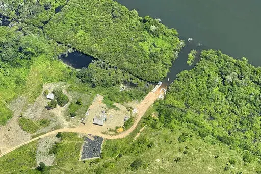 This May 2, 2022, photo provided by Xingu + Network shows an illegal road inside a protected area called Terra do Meio (Middle Earth) Ecological Station in Para state, in the Brazilian Amazon. The dirt road is now just a few miles shy of connecting two of the worst areas of deforestation in the region. (Xingu + Network via AP)