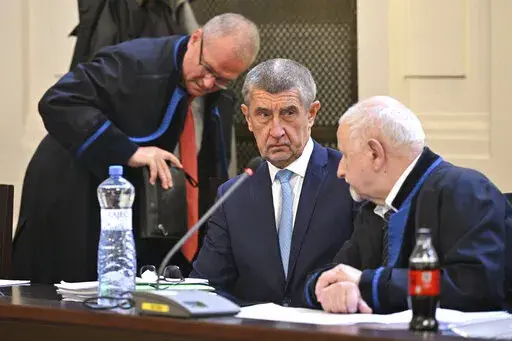 Former prime minister Andrej Babis, center, at the Prague Municipal Court in Prague. Czech Republic, Monday, Sept. 12, 2022.  Babis goes on trial after the prosecution indicted him in a $2 million fraud case involving European Union subsidies. (Vit Simanek/CTK via AP).