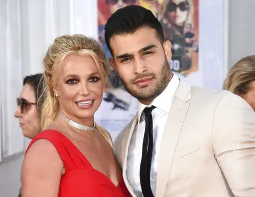 Britney Spears and Sam Asghari appear at the Los Angeles premiere of "Once Upon a Time in Hollywood" on July 22, 2019. Spears has married her longtime partner Sam Asghari at a Southern California ceremony that came months after the pop superstar won her freedom from a court conservatorship. Asghari’s representative Brandon Cohen confirmed the couple’s nuptials. (Photo by Jordan Strauss/Invision/AP, File)