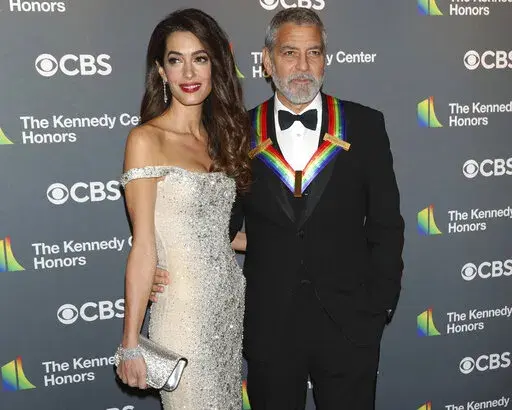 2022 Kennedy Center Honoree George Clooney and his wife, Amal Clooney, arrive at the Kennedy Center Honors on Sunday, Dec. 4, 2022, at The Kennedy Center in Washington. (Photo by Greg Allen/Invision/AP)