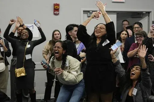 Issue 1 supporters celebrate as Rhiannon Carnes, executive director, Ohio Women's Alliance, speaks at a watch party, Tuesday, Nov. 7, 2023, in Columbus Ohio. (AP Photo/Sue Ogrocki)