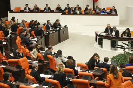 Turkish lawmakers follow the debate of Sweden's bid to join NATO at the Turkish Parliament in Ankara, Turkey, Tuesday, Jan. 23, 2024. Turkish legislators on Tuesday endorsed Sweden's membership in NATO, lifting a major hurdle on the previously nonaligned country's entry into the military alliance. (AP Photo/Ali Unal)